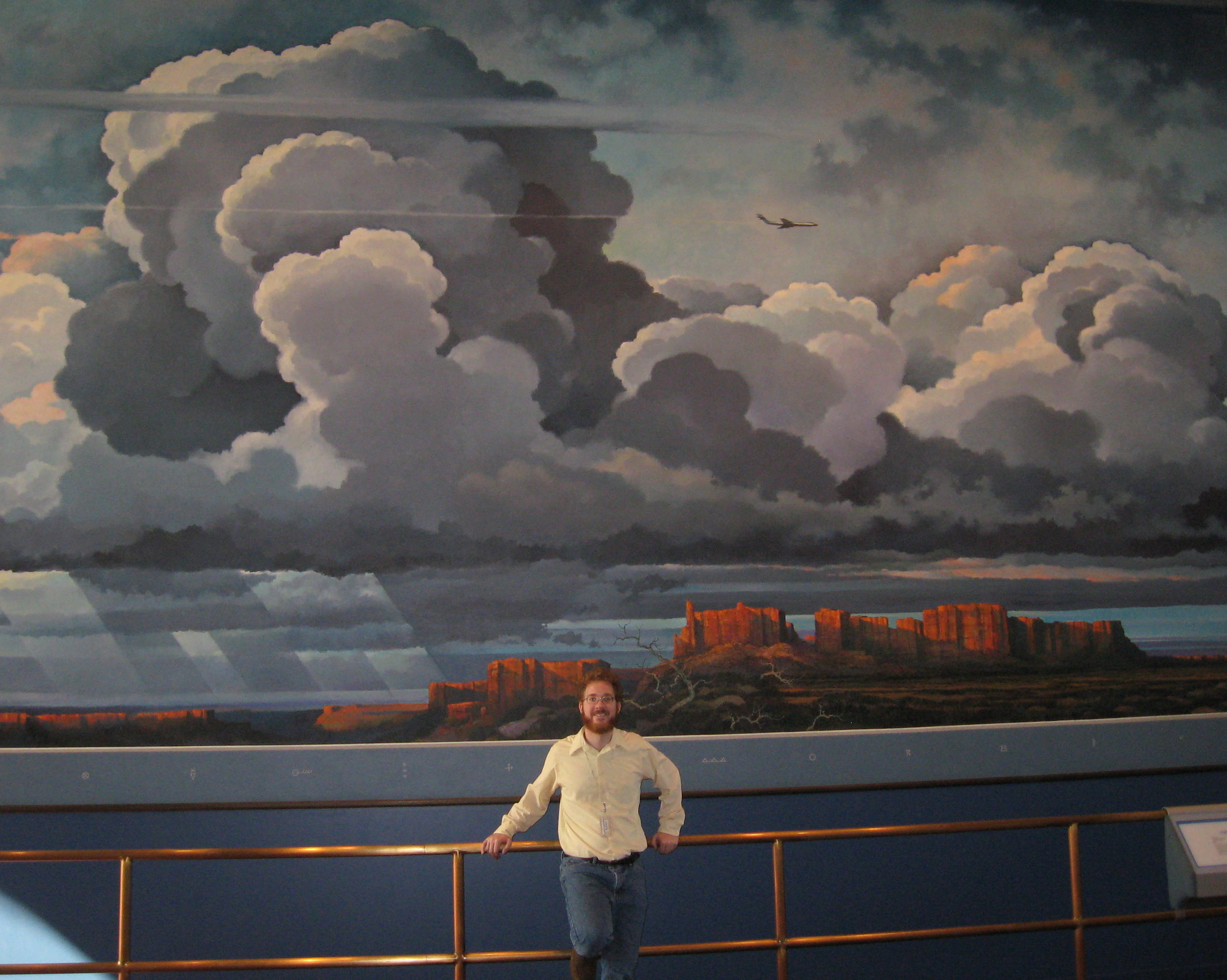 That's me in front of Eric Sloane's mural "Realm of Flight," at the Smithsonian National Air and Space Museum. (Photo courtesy of my mom.)