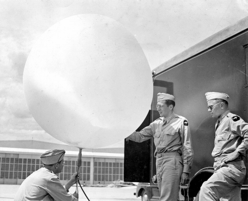 In 1940, Rossby left the US Weather Bureau to establish an Institute of Meteorology at the University of Chicago. There he organized the program that trained the  weather cadet generation : more than 6,000 new weather officers for the US military. George Benton described this as the "explosion in meteorology." Here,&nbsp;three cadets at Chicago practice filling a weather balloon. &nbsp; Image courtesy of the University of Chicago Photographic Archive, apf3-02893, Special Collections Research Center, University of Chicago Library.